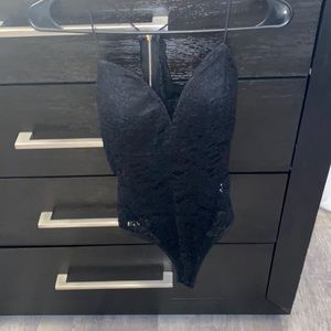 Black lace bodysuit. boobs are not see thru. back zippers up top